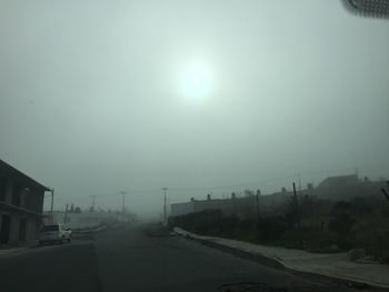 View of road against cloudy sky