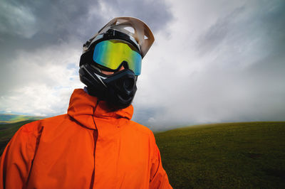 Rear view of man standing on field