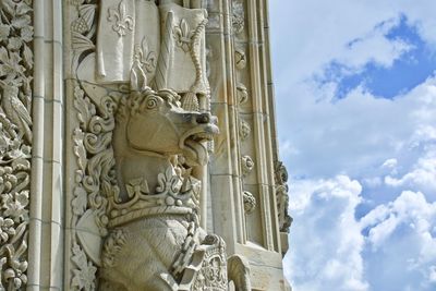 Low angle view of statue against building