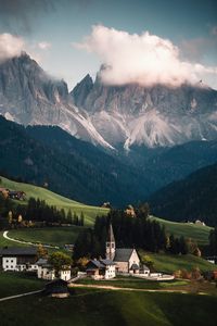 Houses on landscape against mountains