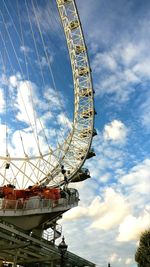 Low angle view of ferris wheel against sky