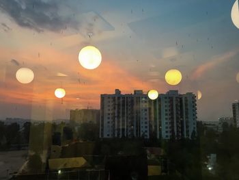 View of city against sky during sunset