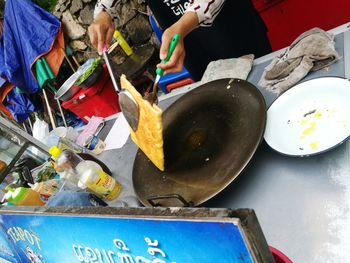 Low section of woman working with food