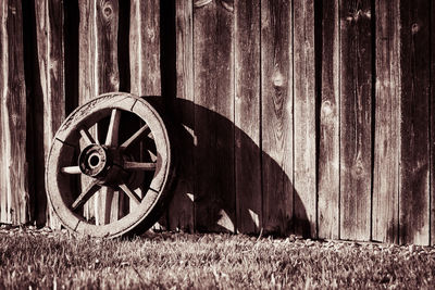 Old wooden fence on grassy field