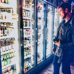 Full length of man looking at store