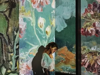 Woman swimming in fish tank at aquarium