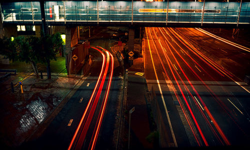 High angle view of light trails on railroad tracks at night