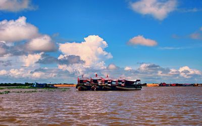 Ship moored on sea against sky