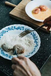 High angle view of person preparing food