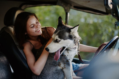 Portrait of dog standing in car