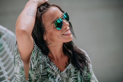 Portrait of young woman wearing sunglasses