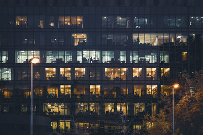 Reflection of illuminated building in lake at night