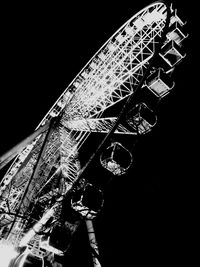 Low angle view of ferris wheel against sky