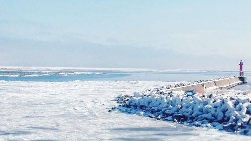 Scenic view of sea against blue sky