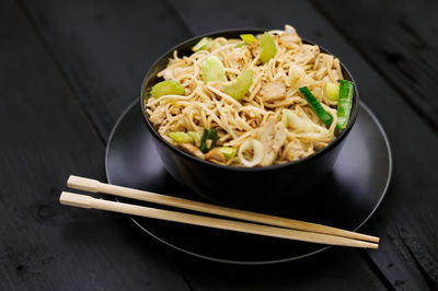 High angle view of chow mein in bowl on table