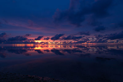 Scenic view of sea against romantic sky at sunset