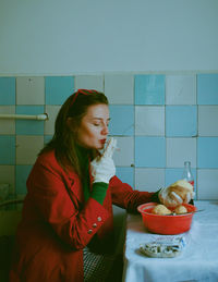 Portrait of smiling friends sitting at home