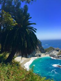 Scenic view of sea against blue sky