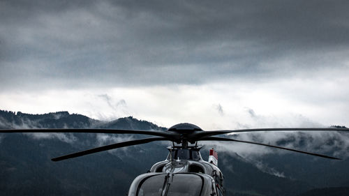 Close-up of helicopter against sky