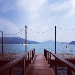 Jetty leading to calm sea