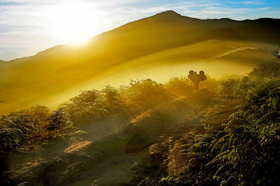 Scenic view of landscape against sky during sunset