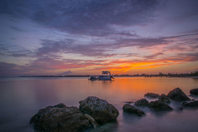 Scenic view of sea at sunset