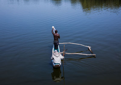 High angle view of man on boat in lake