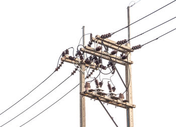 Low angle view of electricity pylon against sky