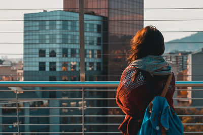 Woman looking at view of city