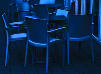 Empty chairs and table in restaurant