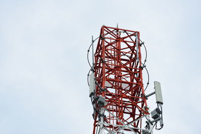 Low angle view of ferris wheel against sky