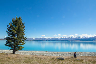 Scenic view of lake against blue sky