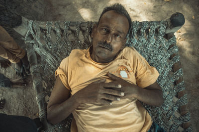 Portrait of man standing at home