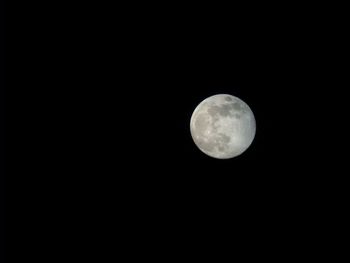 Low angle view of full moon in sky