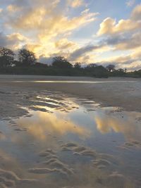 Scenic view of lake against sky during sunset