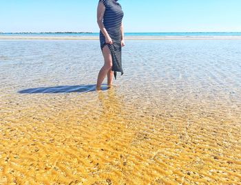 Low section of woman on beach