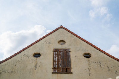 Low angle view of old building against sky