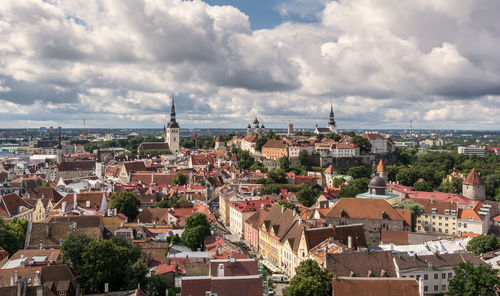 Buildings in tallinn city against cloudy sky