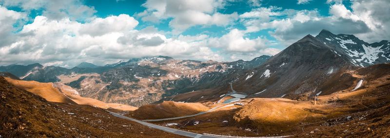 Panoramic view of snowcapped mountains against sky
