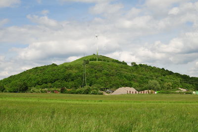 Scenic view of farm against sky