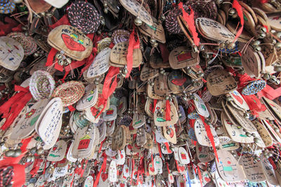 Low angle view of fortune papers hanging from roof