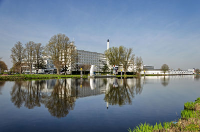 Unesco world heritage the van nelle factory reflecting in the nearby schie canal on a sunny day 