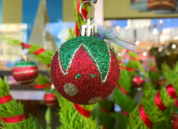 Close-up of christmas decorations hanging on tree