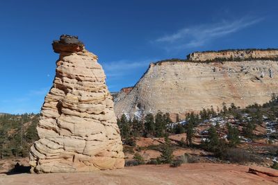 White rock formation and hill at checkerboard mesa