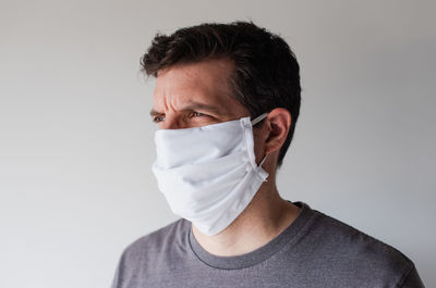 Man wearing homemade cloth face mask during covid 19 pandemic.