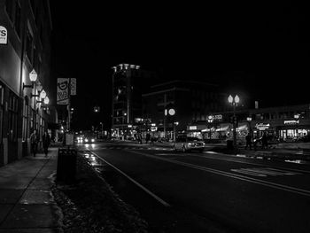 Illuminated street lights at night