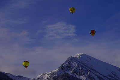 Low angle view of hot air balloons against sky