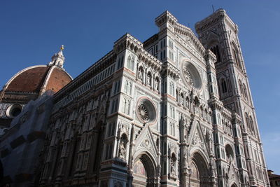 Low angle view of building against sky in city