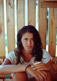 Close-up portrait of young woman at home