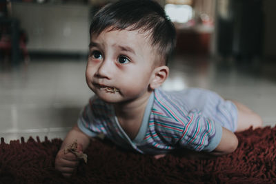 Boy eating food at home